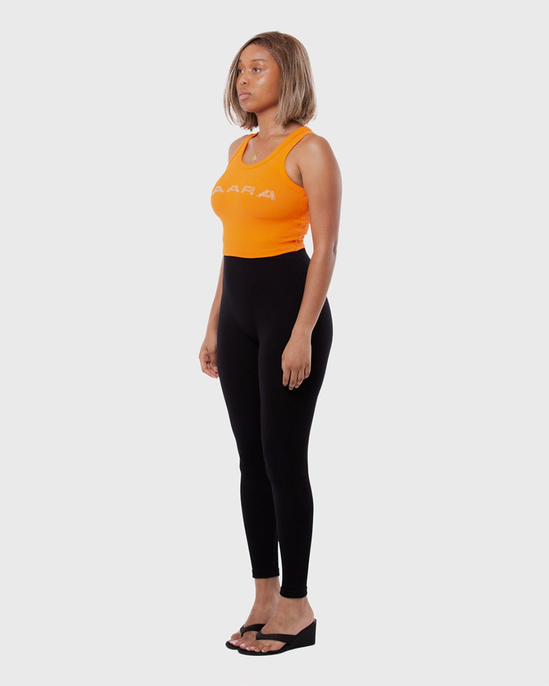 6. BAARA SS26 - ORANGE RHINESTONE TANK TOP