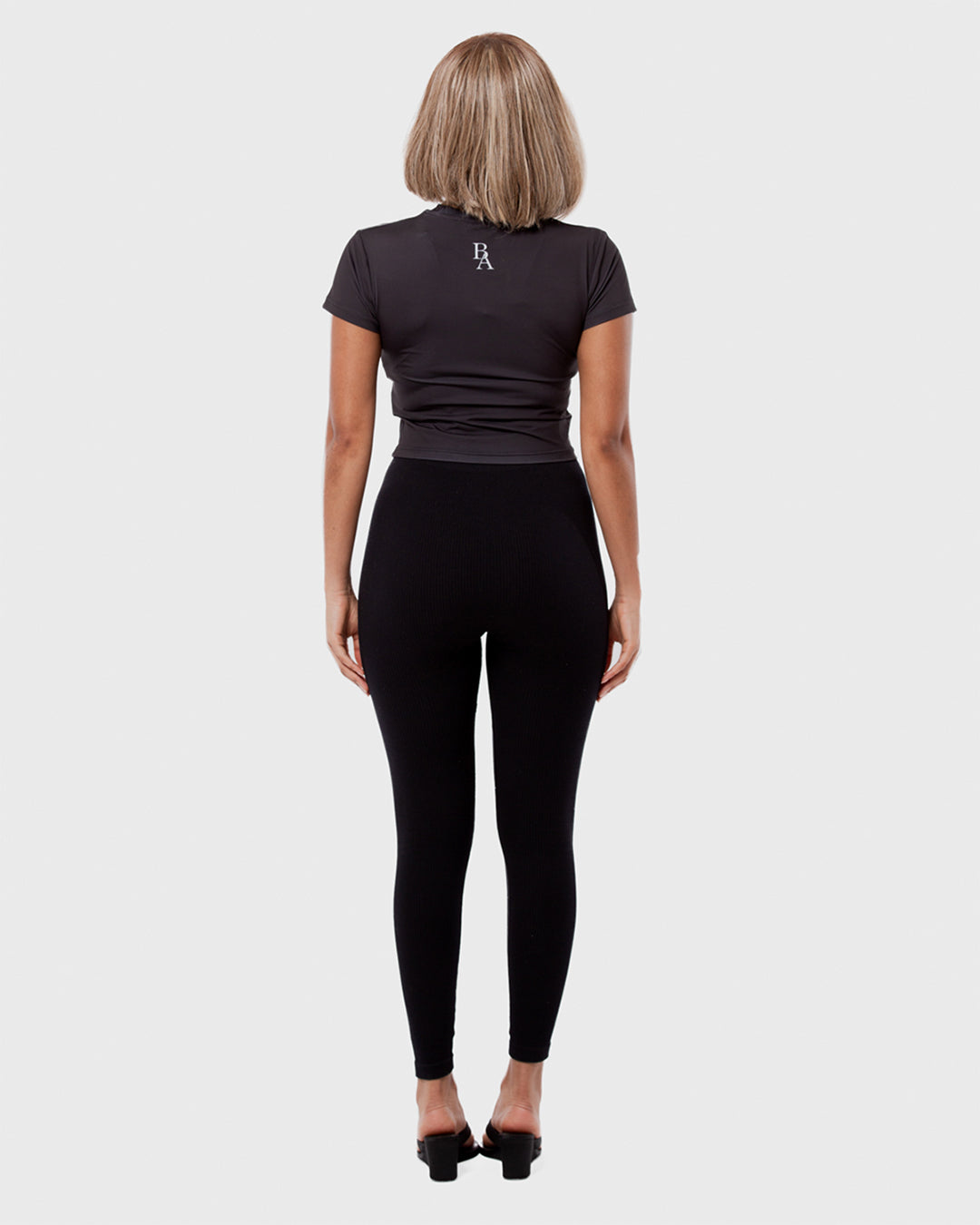 7. BAARA SS26 - BLACK WORLD BABY TOP