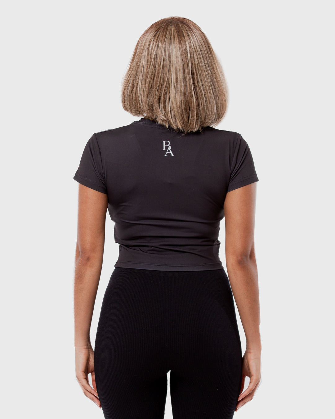 7. BAARA SS26 - BLACK WORLD BABY TOP